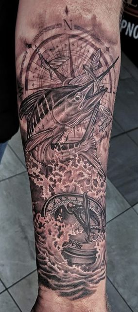 Tattoo of Fish Jumping Out of Ocean Waves With a Compass Rose — Whitsunday Tattooing Airlie Beach in Airlie Beach, QLD
