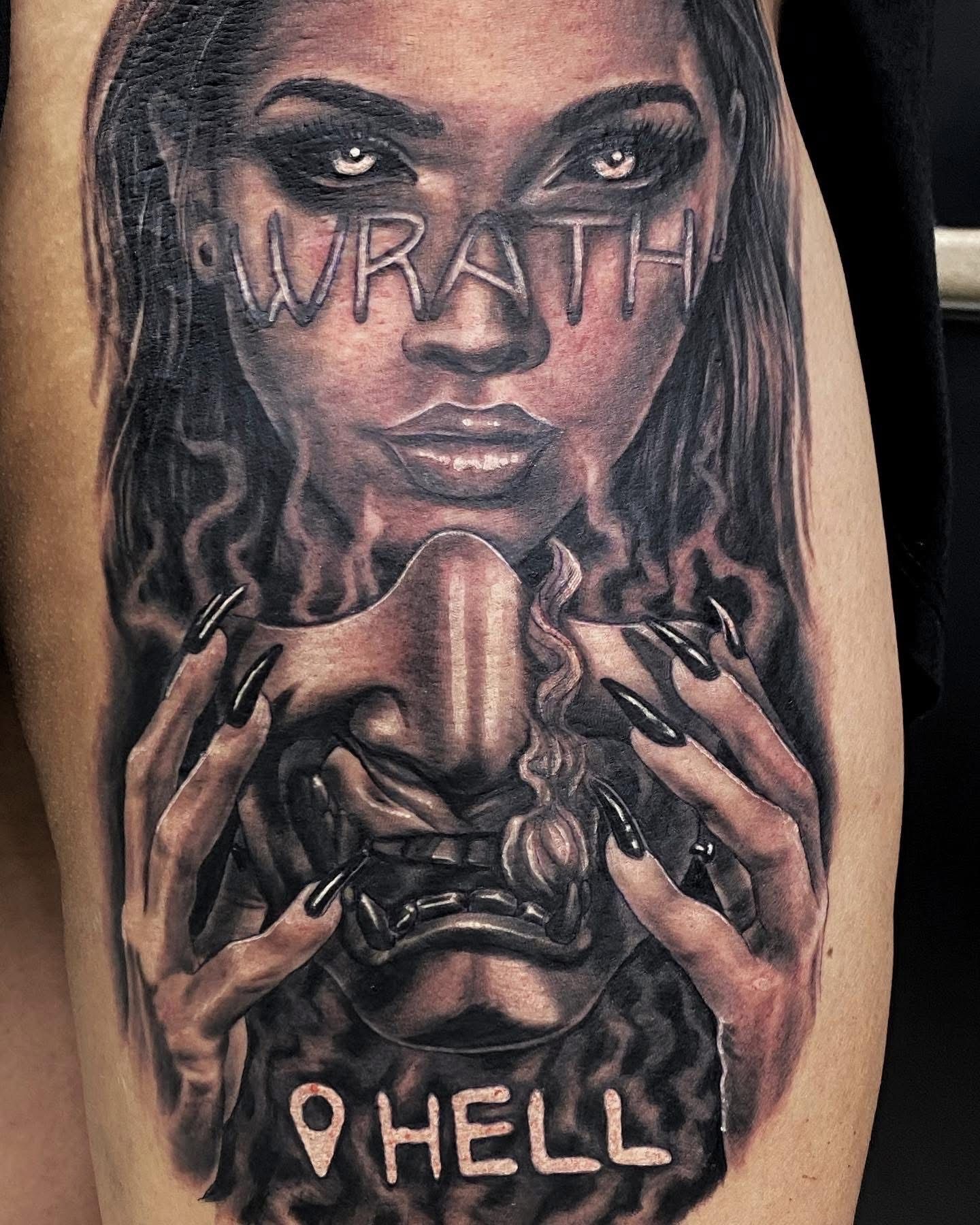 Tattoo of a woman's face with 
