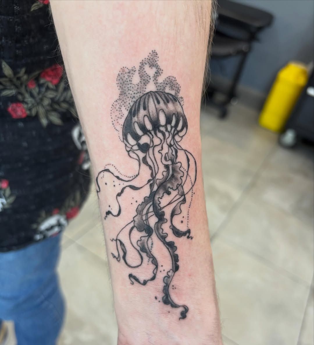 Black jellyfish tattoo on a forearm against a light background — Whitsunday Tattooing Airlie Beach in Whitsundays, QLD