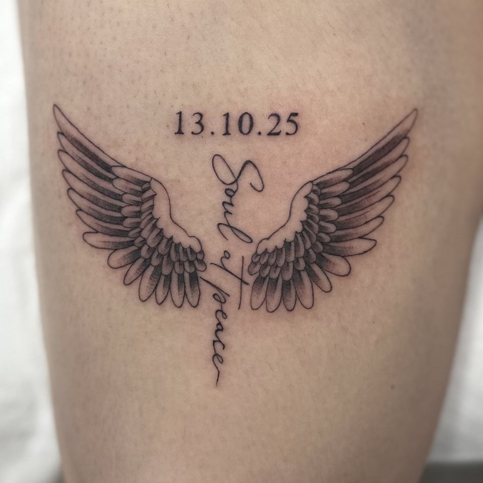 Tattoo of angel wings with 
