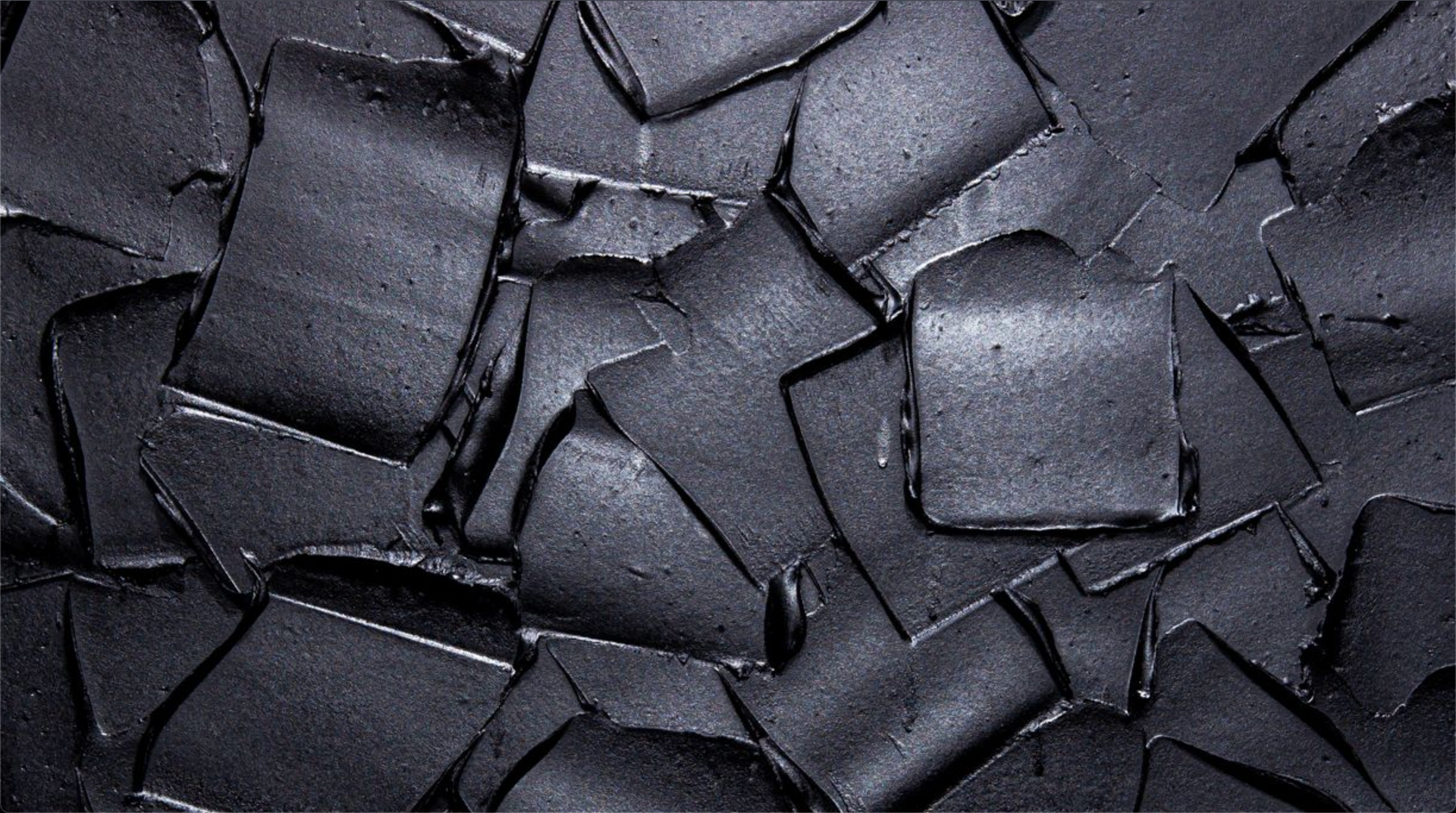 Black, square-shaped pieces, irregularly arranged; art by Matt Remsbecher.