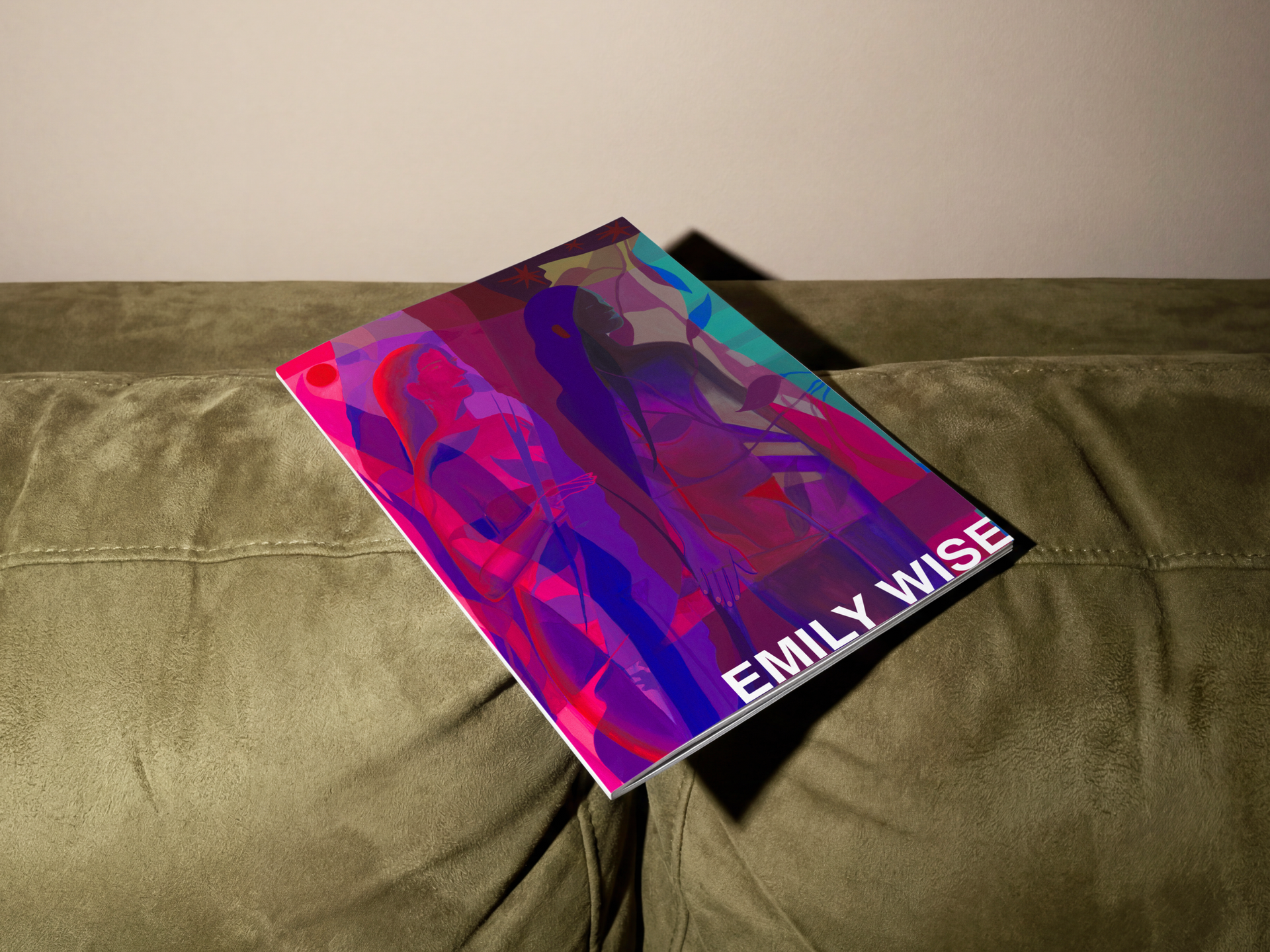 Art by Emily Wise. Colorful Emily Wise book or magazine on a green couch