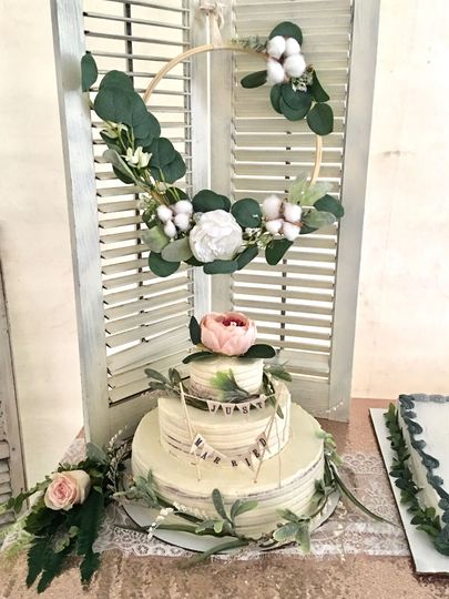 A rustic wedding cake set up at a venue