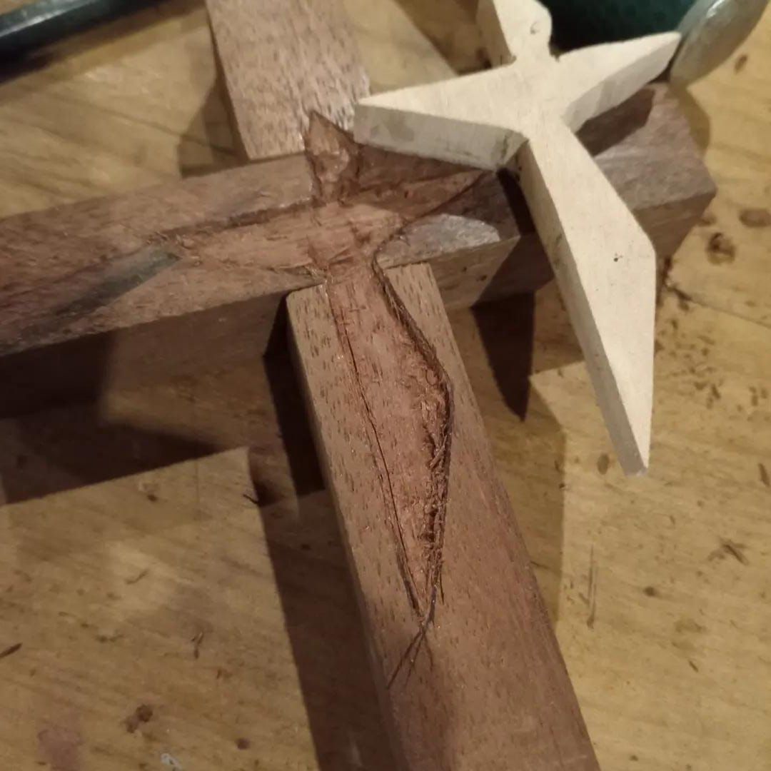 Handcrafted lapacho wood cross being carved in Patagonia