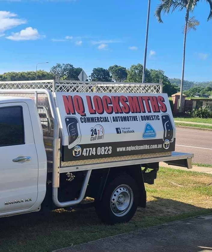 White Truck with A Sign Parked on A Street — Nq Locksmiths In Kirwan, QLD