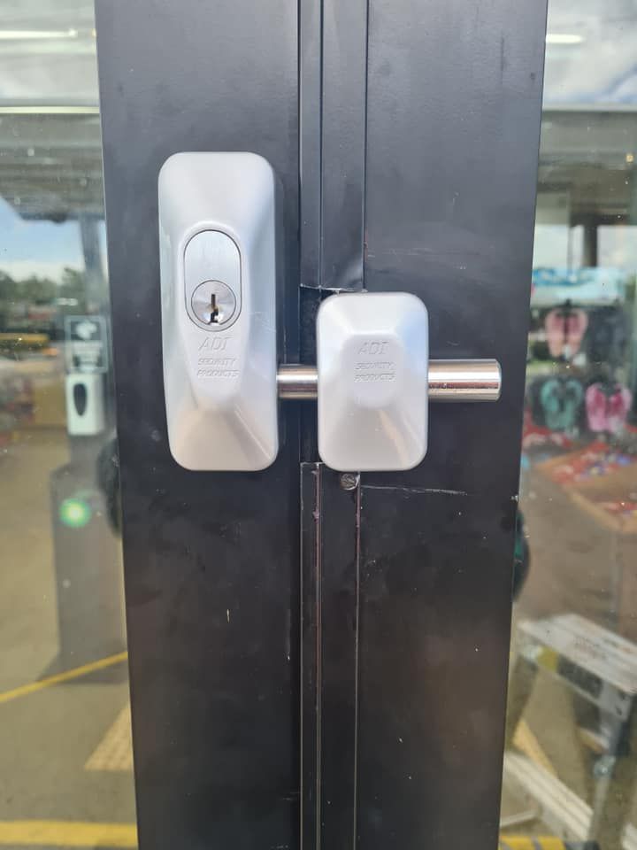 Silver Door Lock and Bolt on A Black Door — Nq Locksmiths In Kirwan, QLD