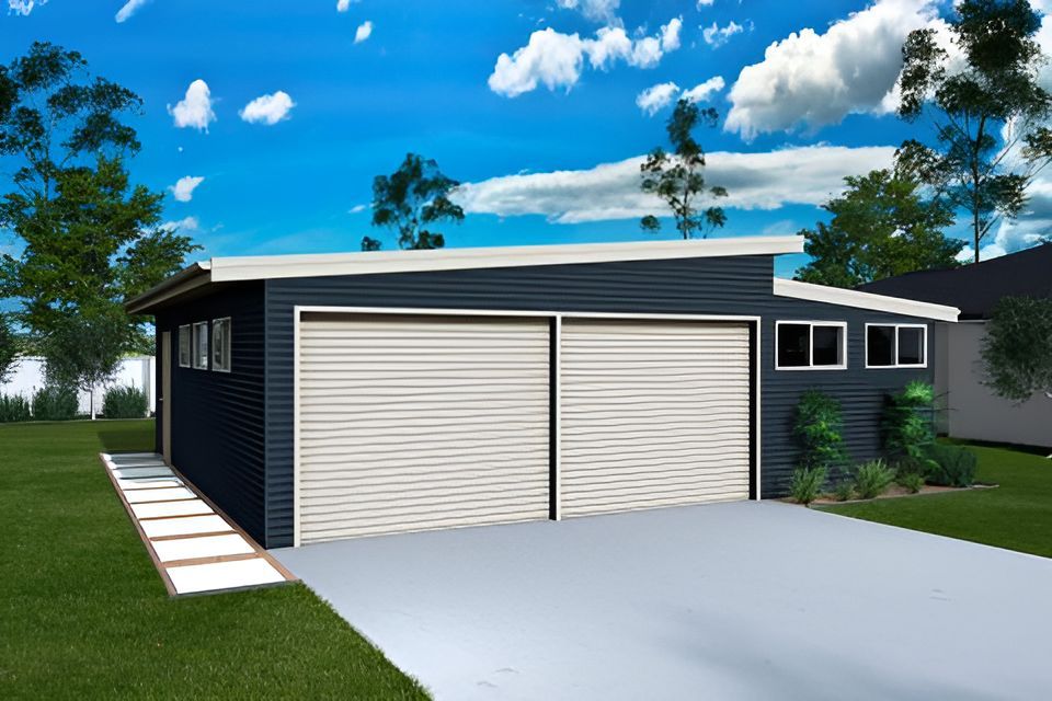 A Garage With Two Garage Doors and a Driveway in Front of a House — Mareeba Sheds & Gas In Mareeba, QLD