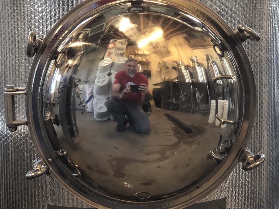 A man taking a picture of himself in a mirror