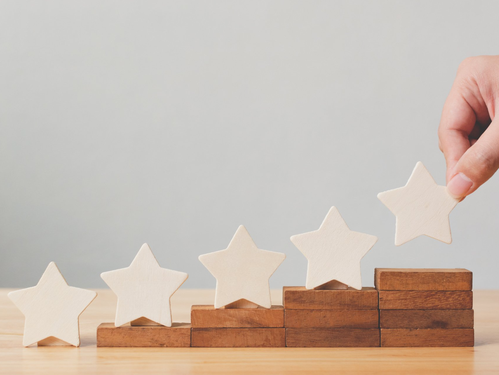 hand lining up stars