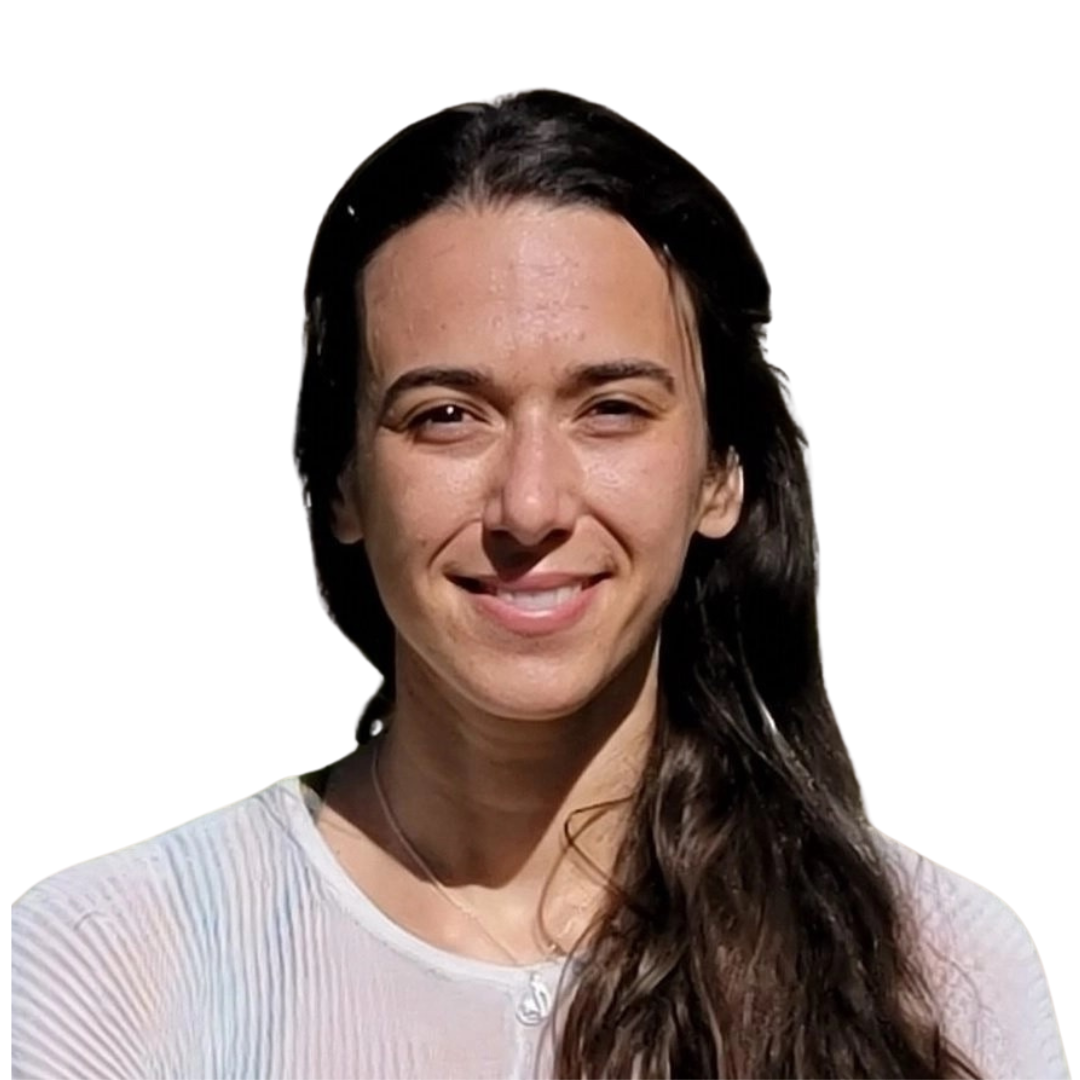 A woman with long hair is smiling and wearing a white shirt.