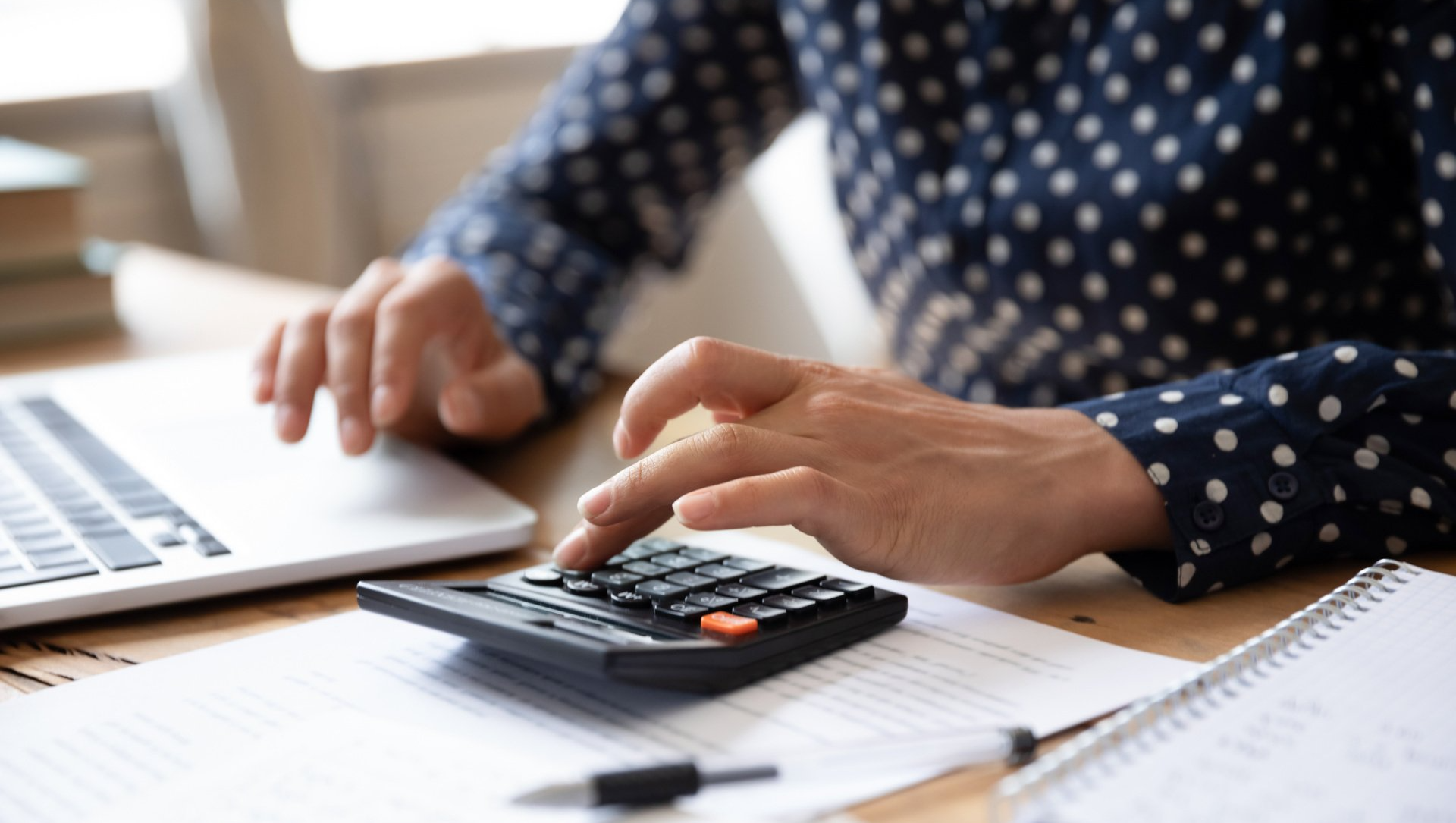 hands using calculator