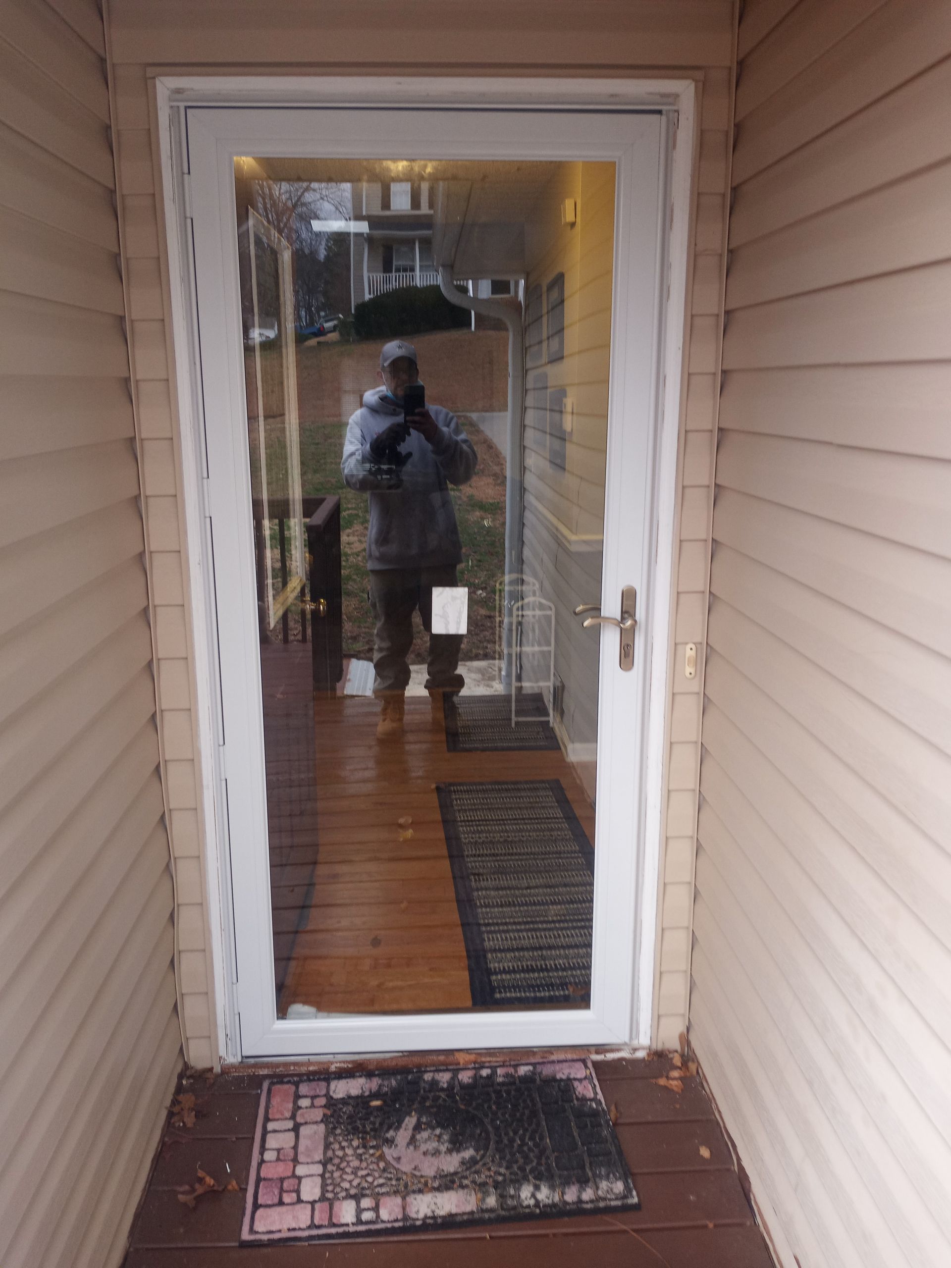 A door with a reflection of a person in it
