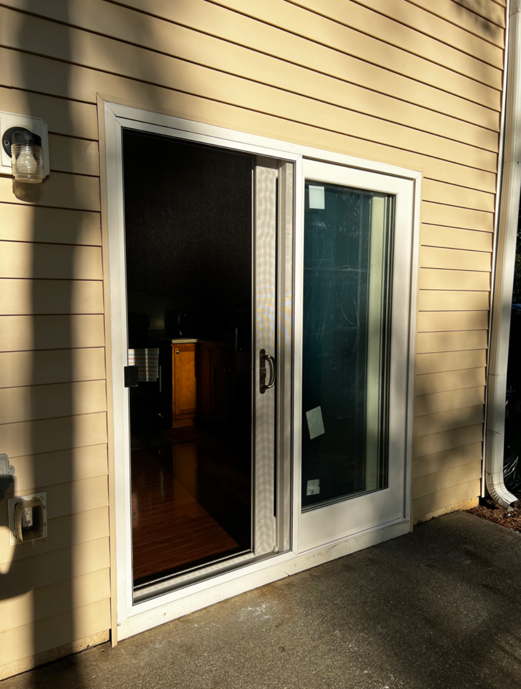 A house with a sliding glass door that is open