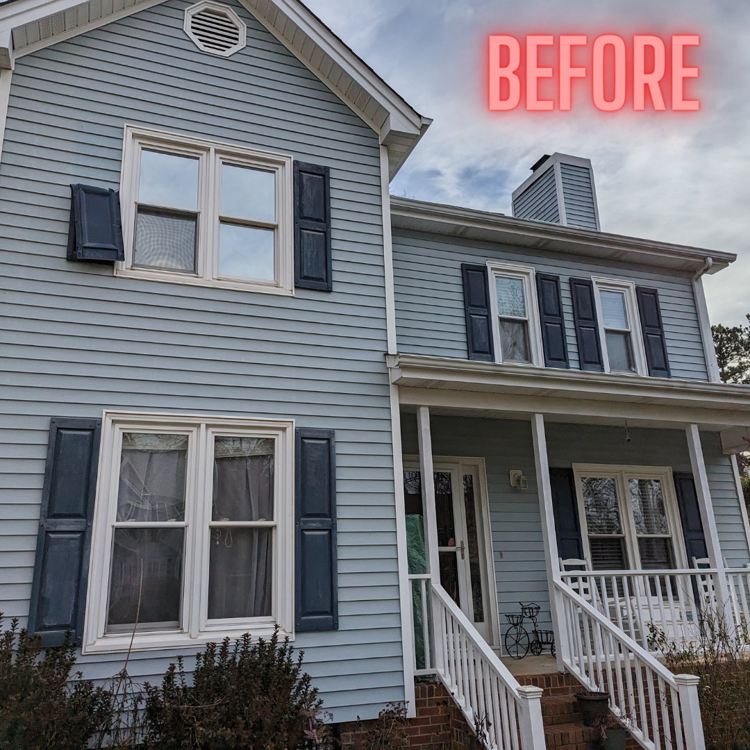 A before picture of a house with blue shutters