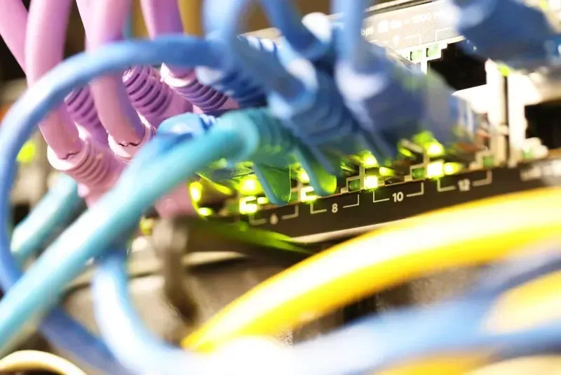 Network Cables Plugged Into a Server, Various Colors, With Indicator Lights — Superior Wifi in Lennox Head, NSW