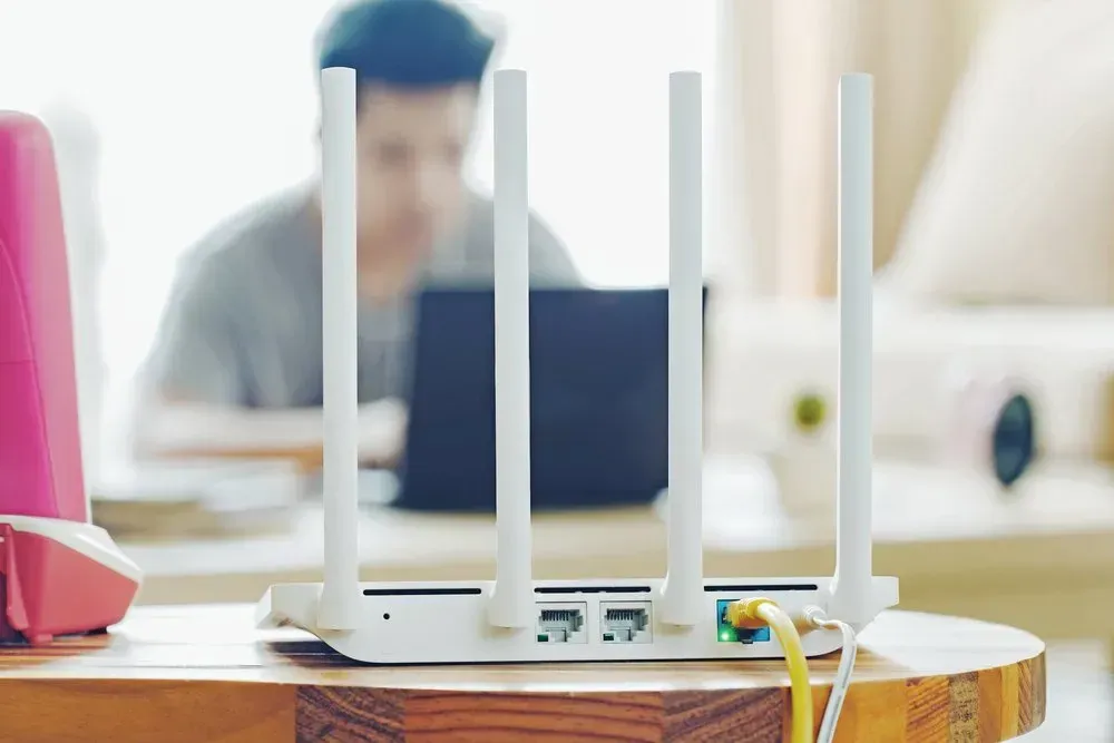 White Wifi Router With Four Antennas And Cables Plugged In — Superior Wifi in East Ballina, NSW