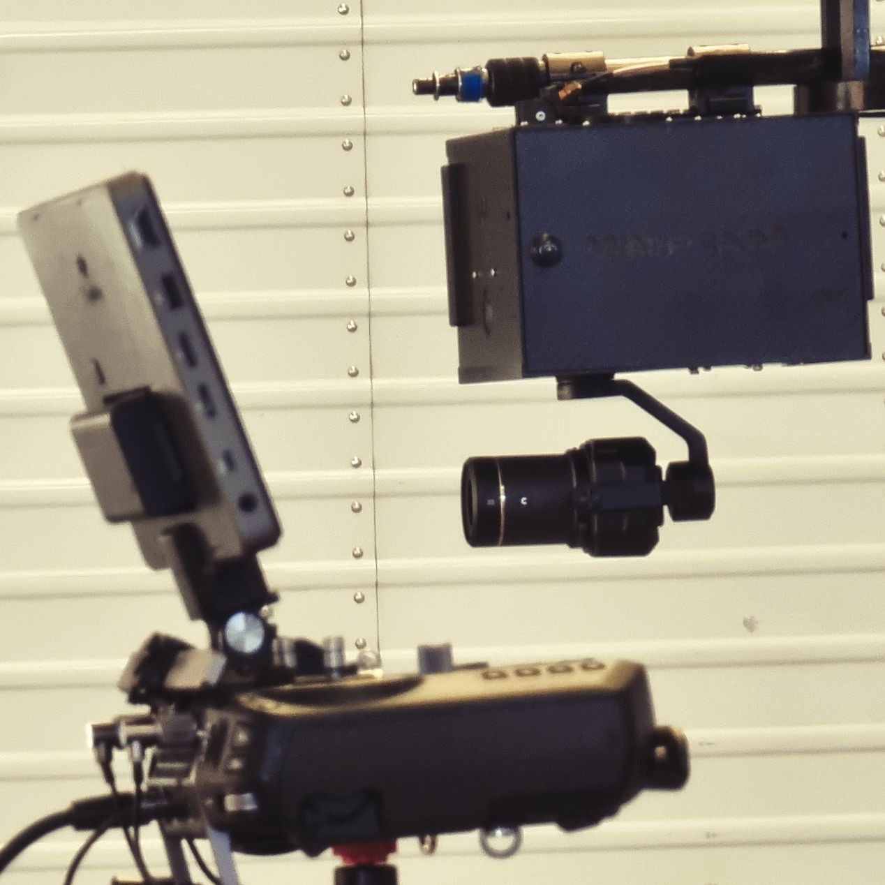 WarpCam® camera components arranged on a workbench.