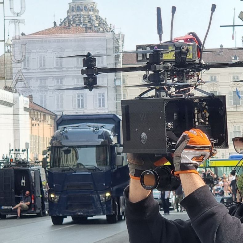 Film crew and actors preparing for the next big sequence, WarpCam® in view.