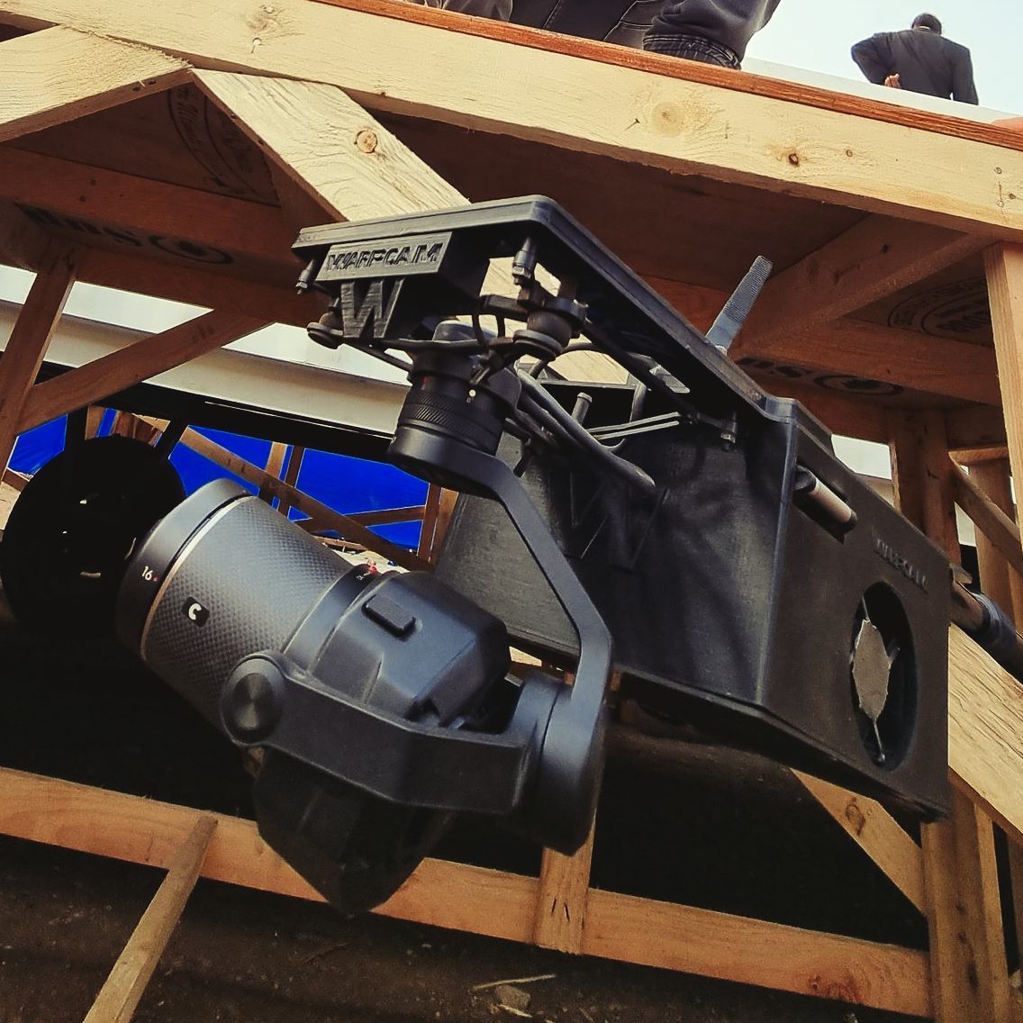 WarpCam® camera rig mounted beneath a wooden platform.