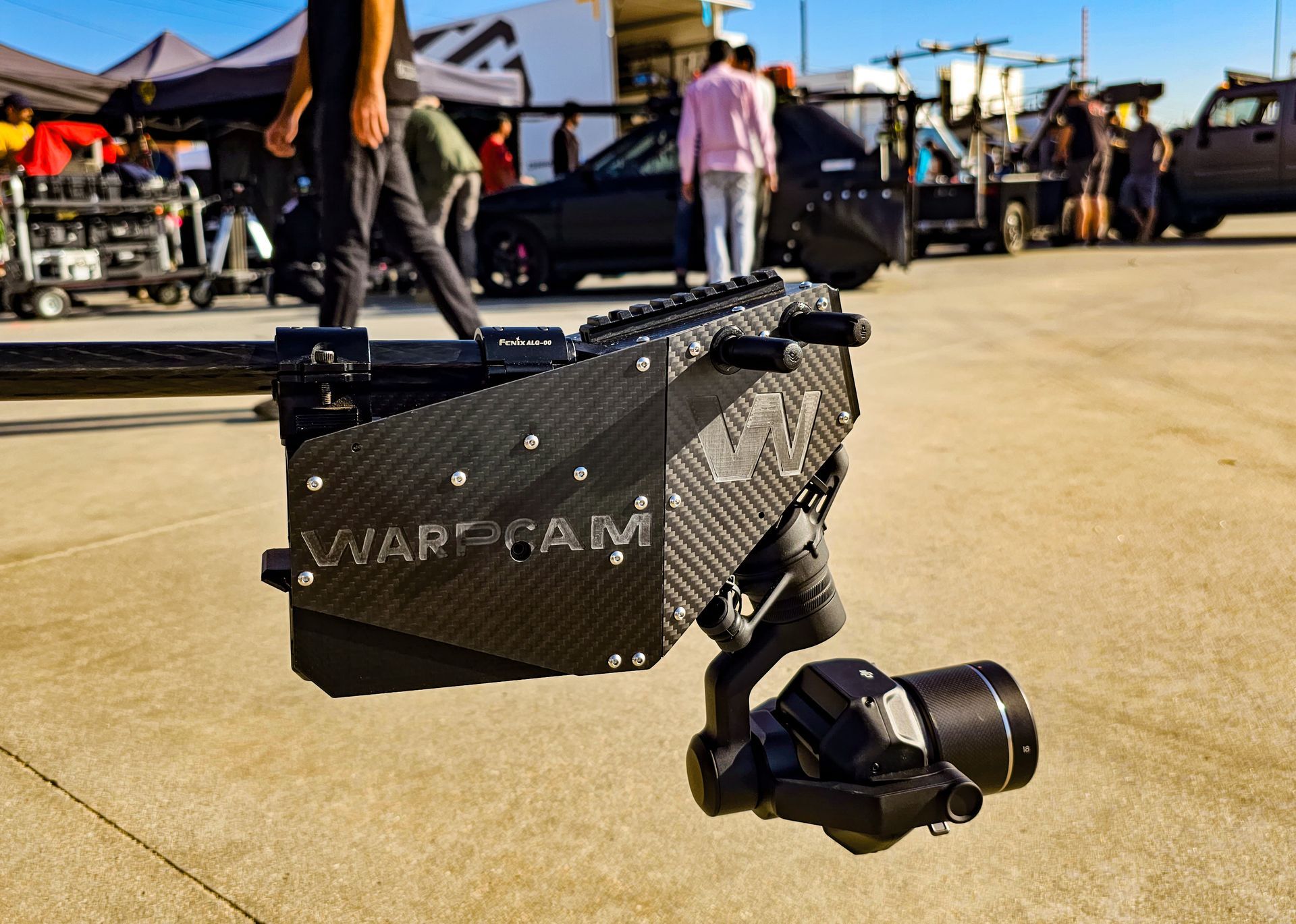 WarpCam® mounted on a rig during an action sequence with crew nearby.