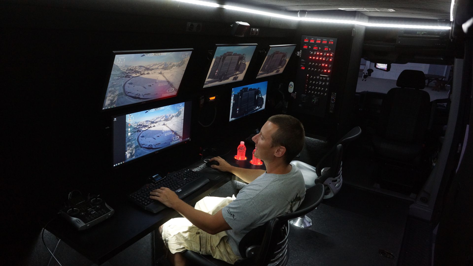 Mobile command center interior with two fixed workstations.