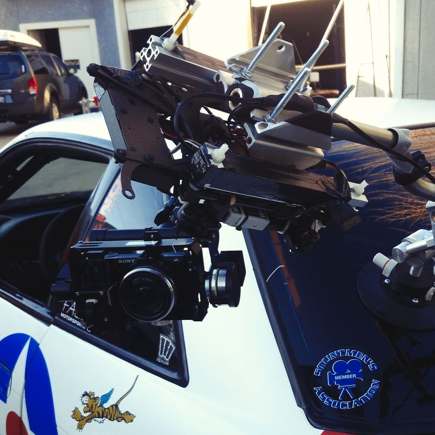 Film crew using WarpCam® on movie set during high-speed action sequence.