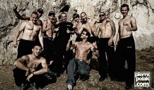 Team photo after completing the 45 meter Burgsteinfelsen stunt in Dollnstein Bavaria with everyone giving thumbs up in front of the cliff