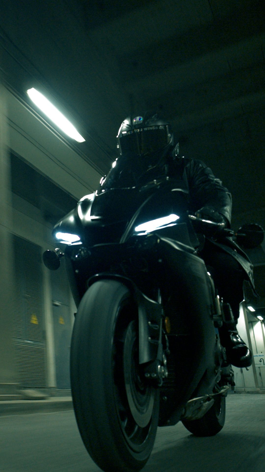 Low-angle WarpCam® view of a motorcyclist speeding through a tunnel.