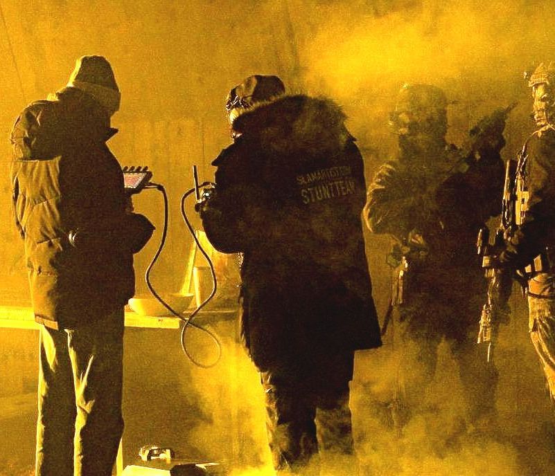 Ferdi Fischer briefing tactical performers with a WarpCam® remote on a commercial set.