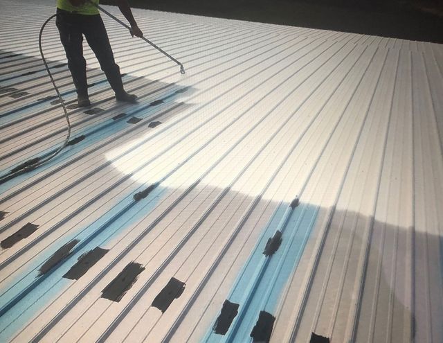 Spray Painting Of Roof — Cedar Valley, IA — Raber Roofing Systems LLC.