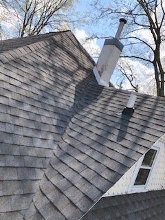 Asphalt Roof With Chimney— Cedar Valley, IA — Raber Roofing Systems LLC.