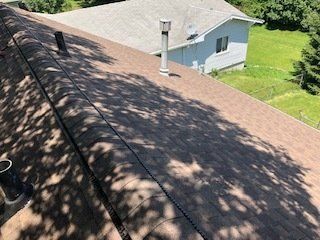 Roof Beside A Tree— Cedar Valley, IA — Raber Roofing Systems LLC.