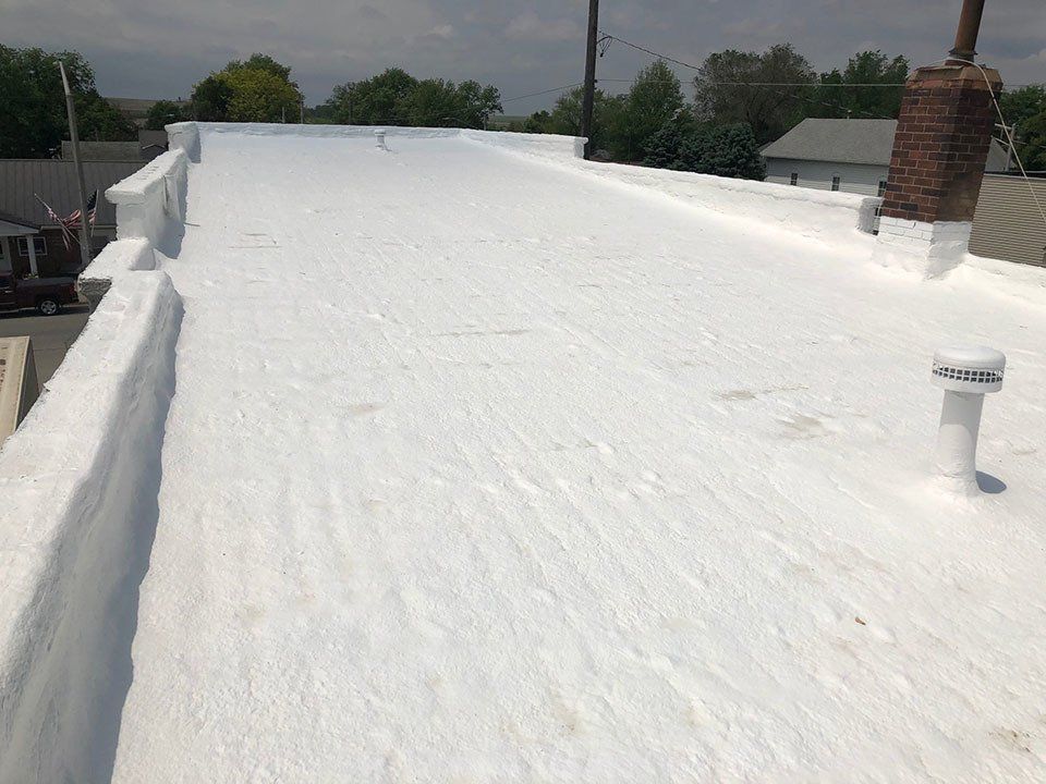 White Paint On Roof — Cedar Valley, IA — Raber Roofing Systems LLC.