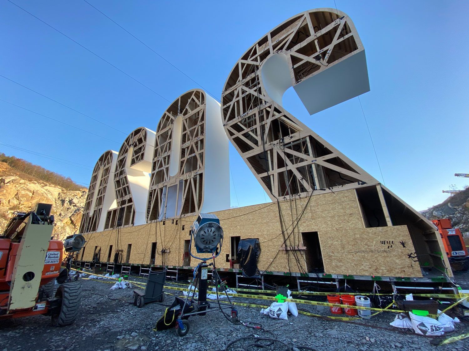 a large wooden sculpture of the number 2 is being built .