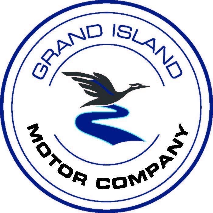 Grand Island Motor Company logo with blue bird and road in a circular emblem