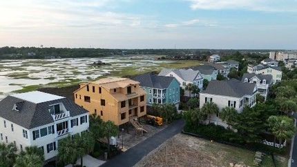An aerial view of a residential area with houses under construction.