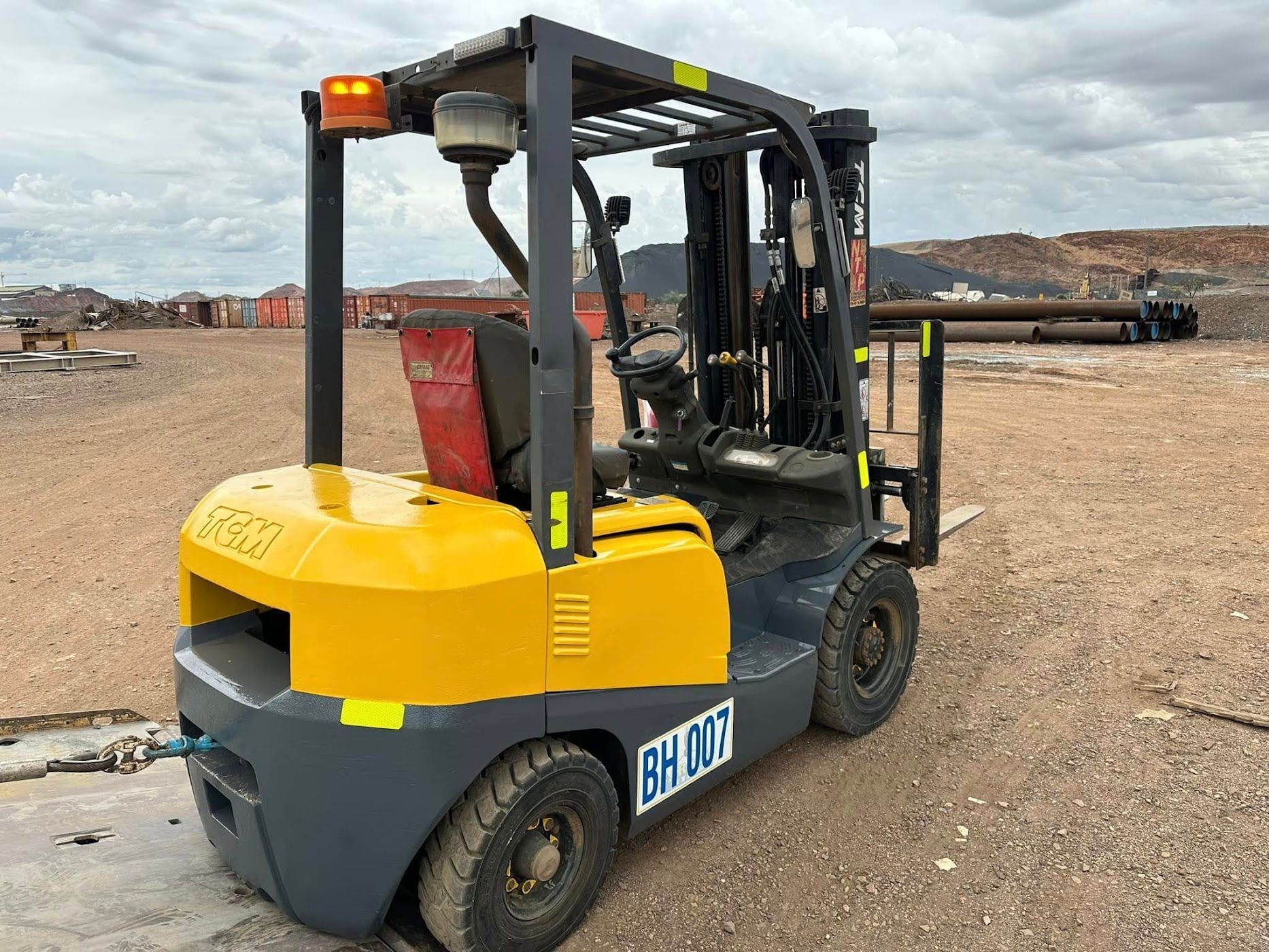 White Truck is Being Lifted by a Crane With the Letters Lcm on the Side — Barkly Hire in Ryan, QLD