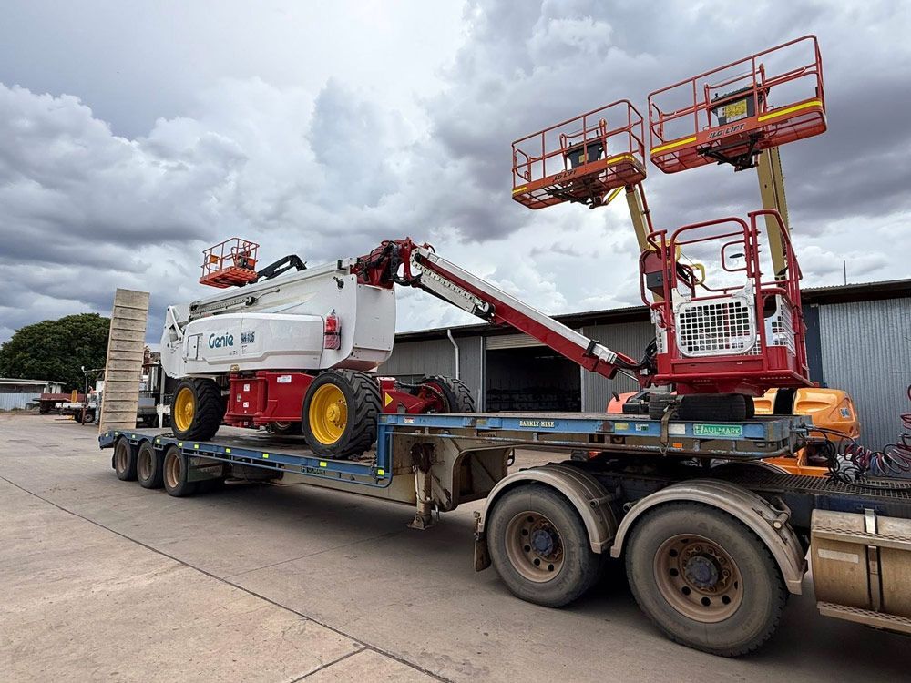 Two Cranes Are Lifting a Large Mining Truck — Barkly Hire in Ryan, QLD