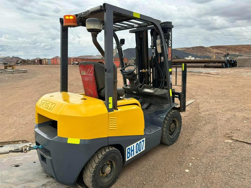Yellow and Grey Forklift is Parked in a Dirt Field — Barkly Hire in Ryan, QLD