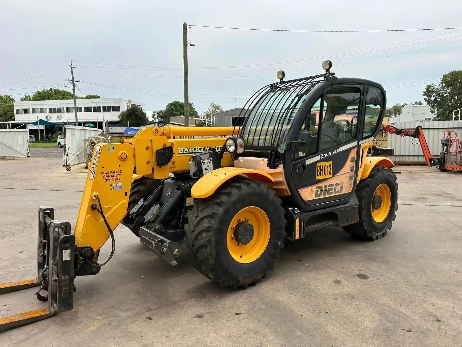 Yellow Telescopic Forklift With Front Attachment — Barkly Hire in Camooweal, QLD