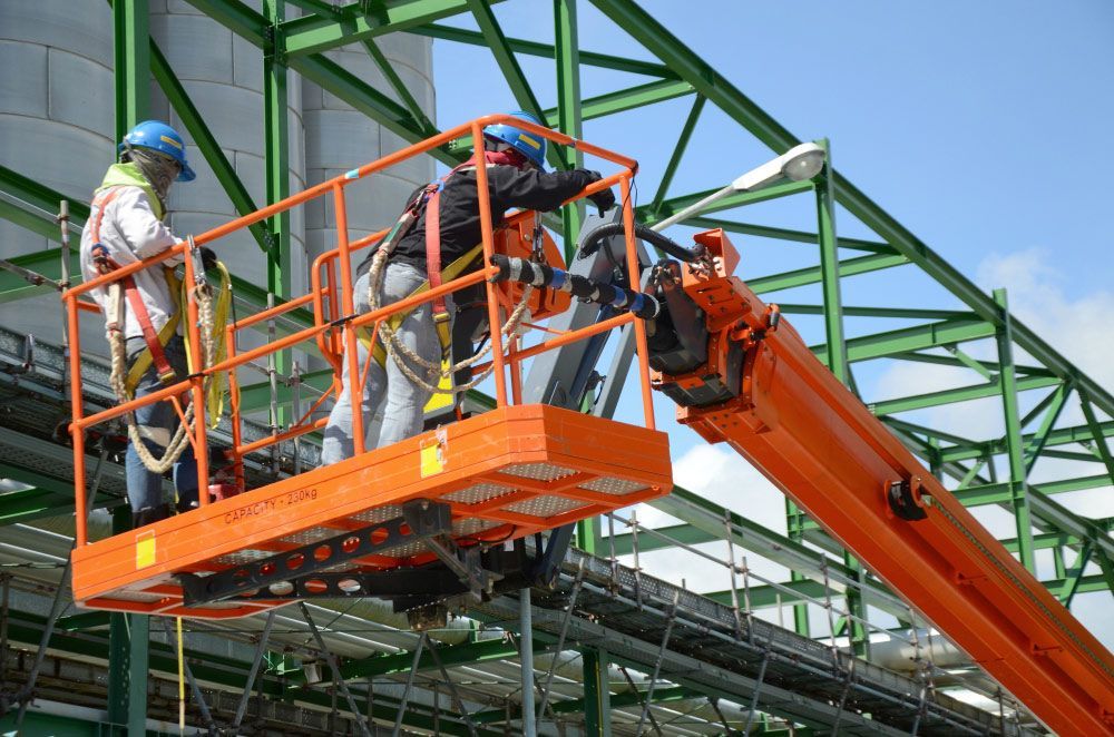 Two Construction Workers Are Working on a Crane — Barkly Hire in Ryan, QLD