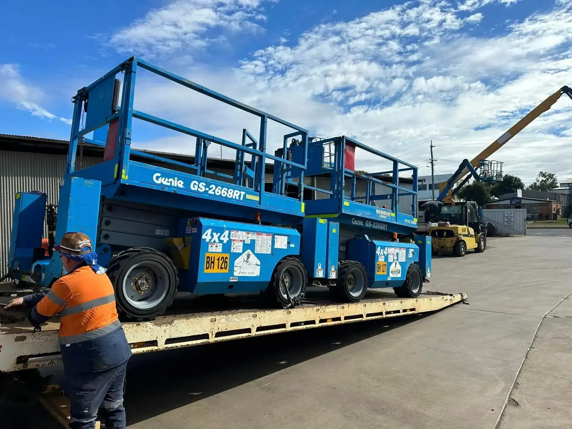 Yellow Mobile Crane Parked Outdoors Beside a Large Building — Barkly Hire in Richmond, QLD