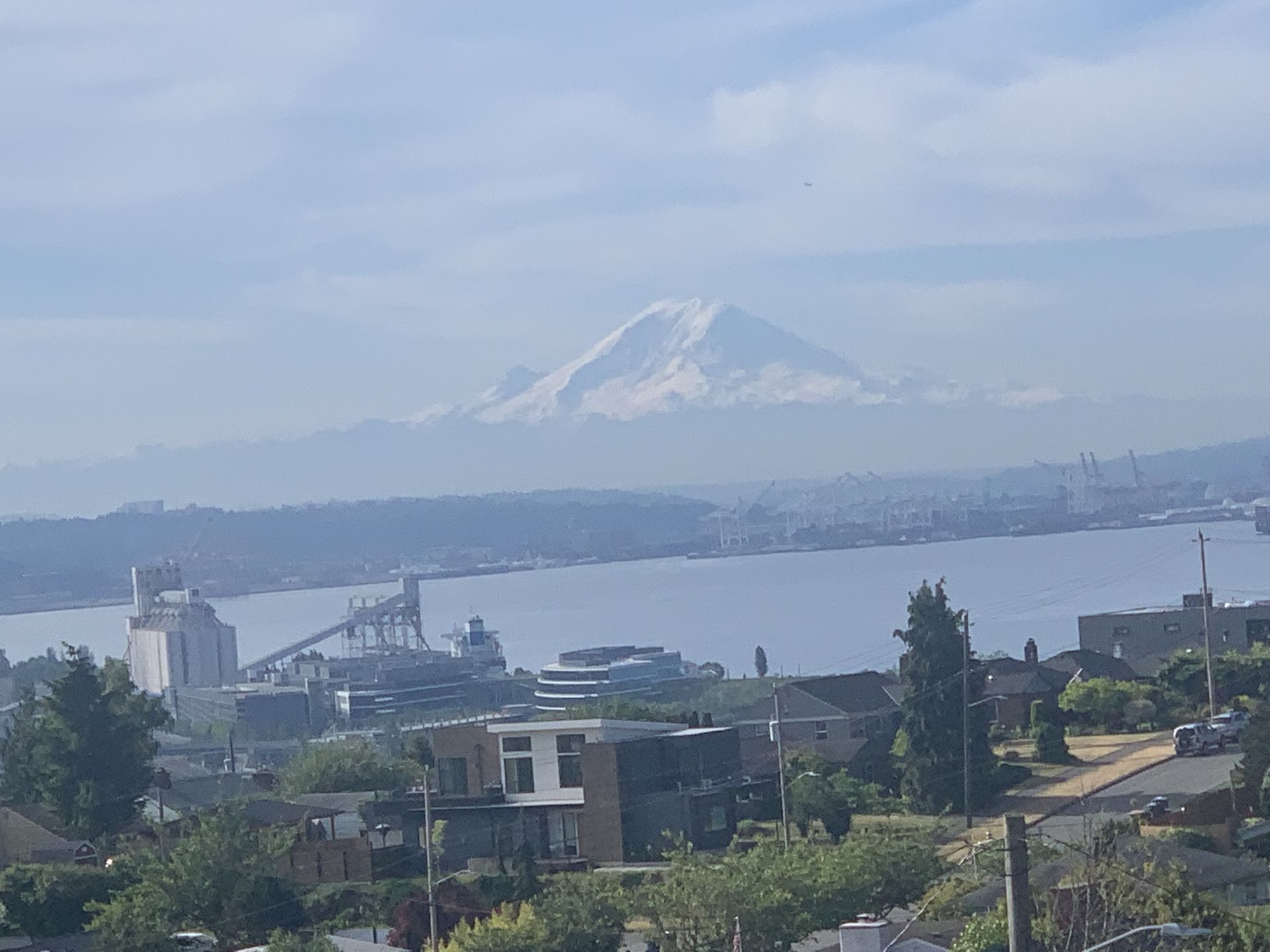 A view of a city with a mountain in the background