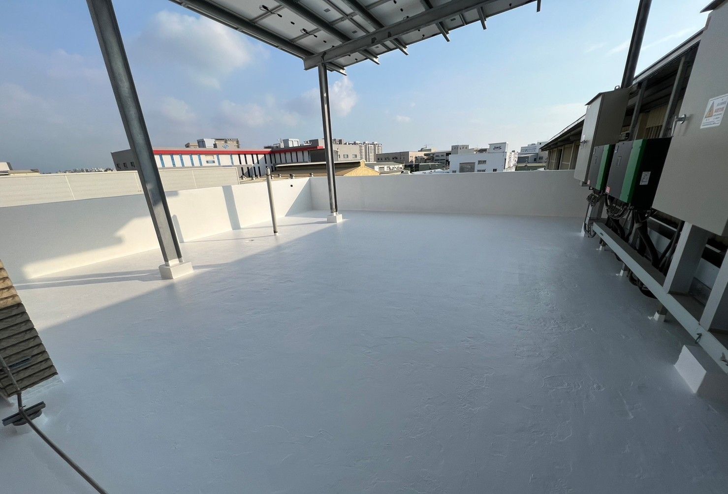 A rooftop with a lot of electrical equipment on it