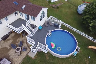 An aerial view of a large house with a swimming pool