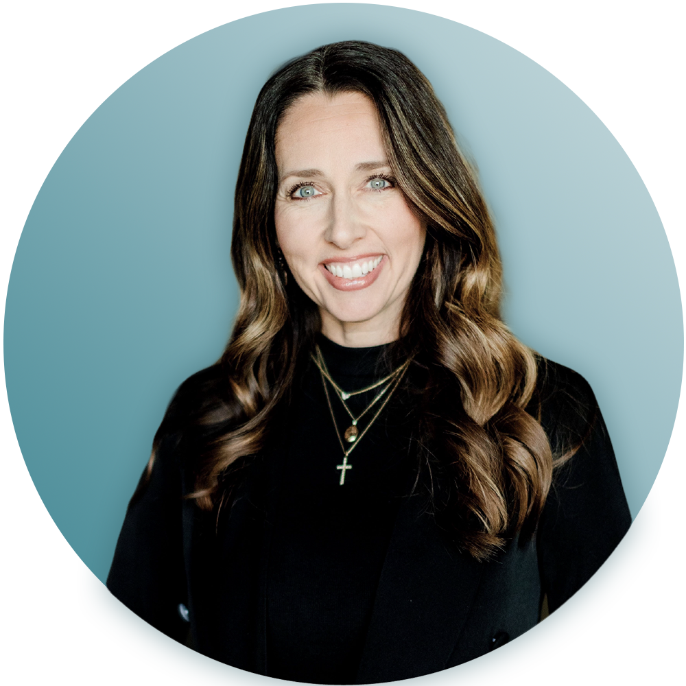 A woman wearing a black shirt and a cross necklace is smiling in a circle.