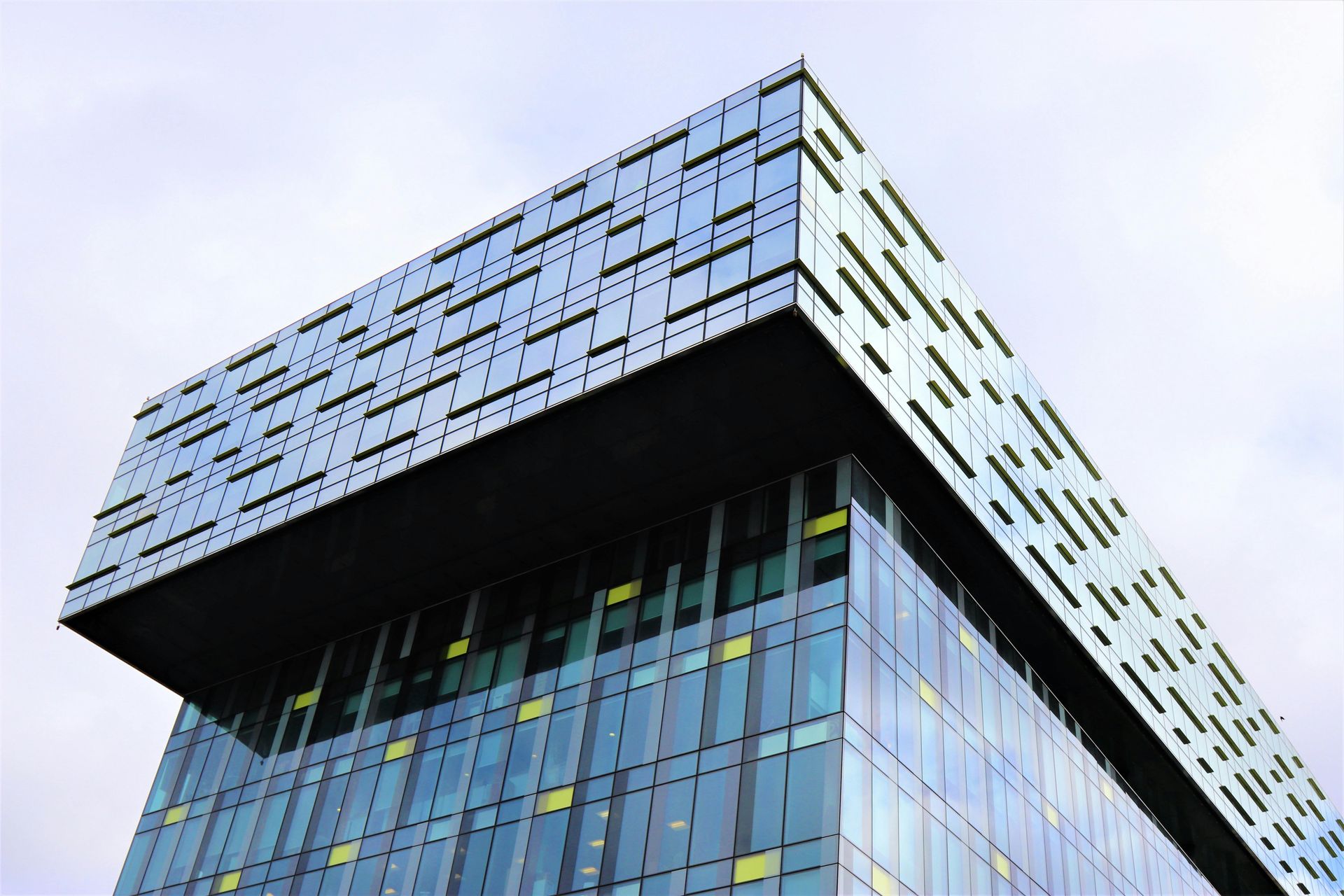 Looking up at a tall building with a lot of windows