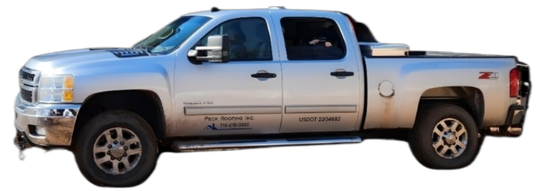 A silver pickup truck is parked on a white background.