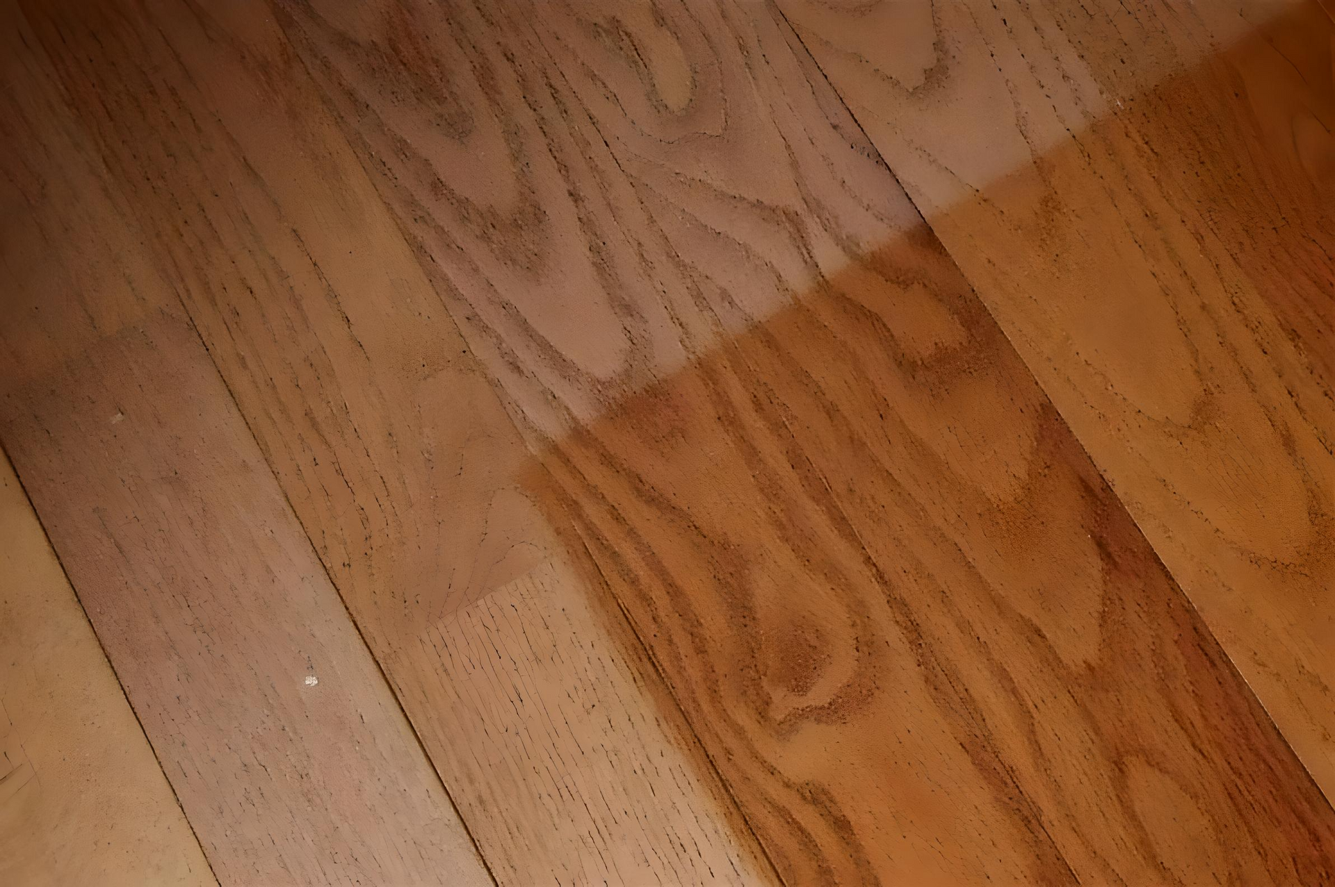 A close up of a wooden floor with different shades of wood