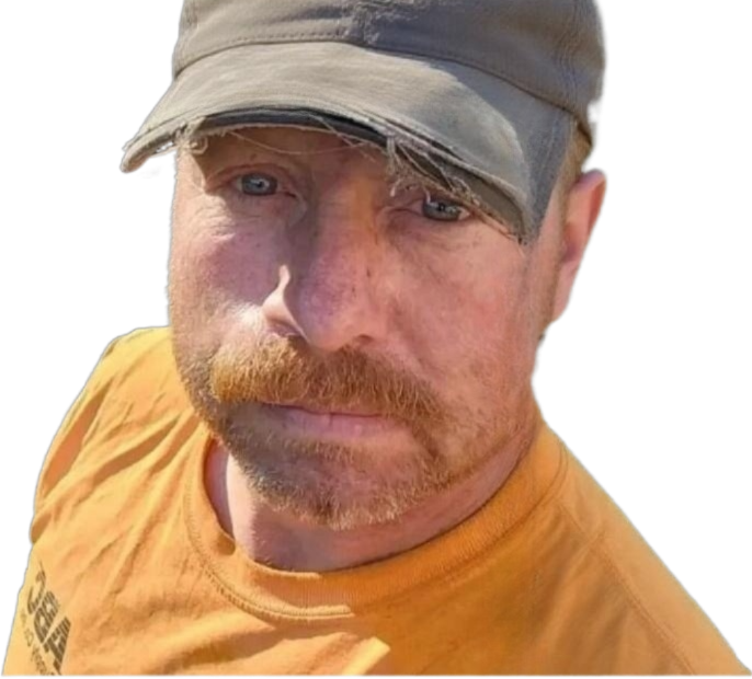 A man wearing a hat and a yellow shirt with the word orba on it